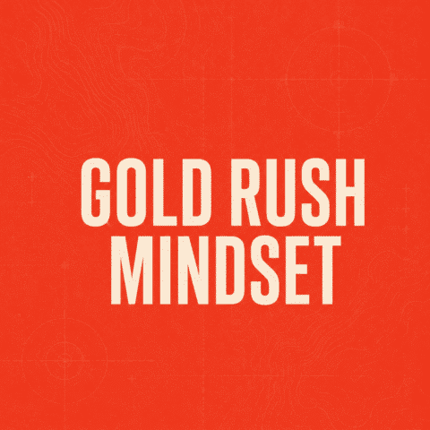 Poster with the phrase 'GOLD RUSH MINDSET' in large white letters on an orange background.